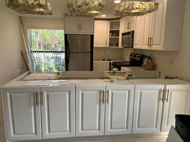 Remodeled kitchen with waterfall marble island in Hollywood, FL